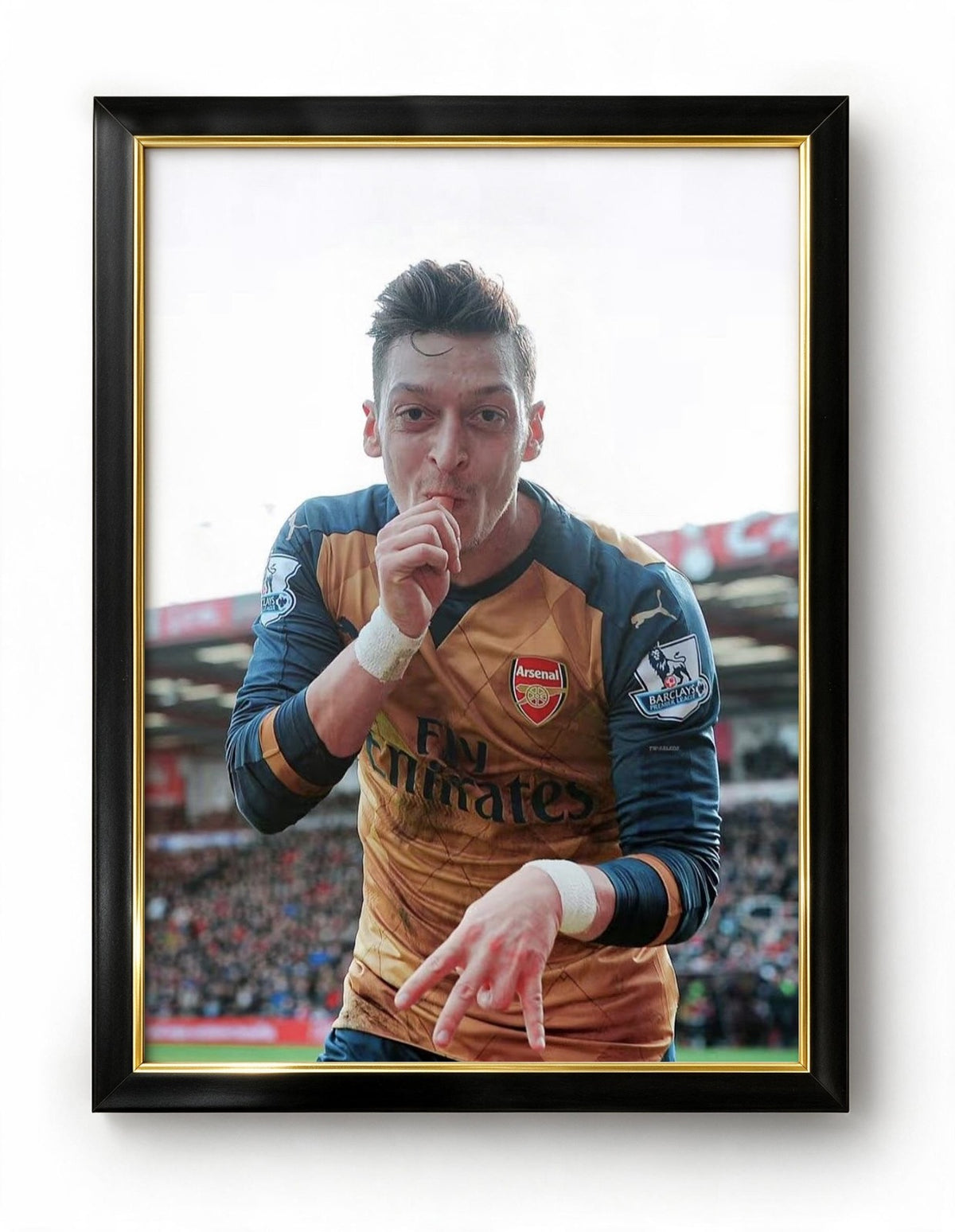 Ozil celebrating Frame